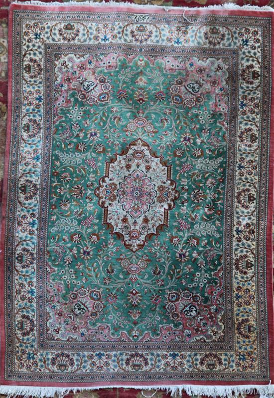 An Isphahan style silk rug, 4ft 9in by 3ft 4in.